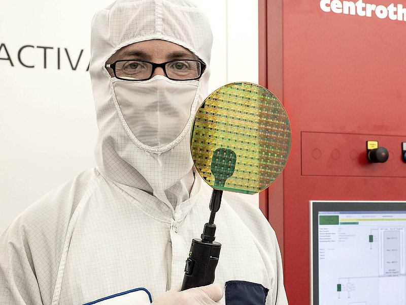 an operator holding a SiC wafer